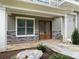 Up close exterior shot of covered front porch with stacked stone facade at 139 Poplar Grove Rd, Mooresville, NC 28117