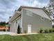 Exterior of a three-car garage with stone accents and clean design on a landscaped lot at 139 Poplar Grove Rd, Mooresville, NC 28117