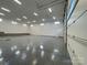 Expansive garage space featuring a pristine epoxy floor and multiple overhead lights at 139 Poplar Grove Rd, Mooresville, NC 28117