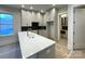 Bright kitchen featuring white cabinets, an island, and stainless steel appliances at 139 Poplar Grove Rd, Mooresville, NC 28117