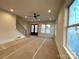 Unfinished living room with staircase, ceiling fan and view of the front porch at 139 Poplar Grove Rd, Mooresville, NC 28117