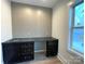 A functional office area features a built-in desk and stylish accent wall at 139 Poplar Grove Rd, Mooresville, NC 28117