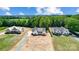 Aerial view of three homes and surrounding landscape at 2610 Henry Baucom Rd, Monroe, NC 28110