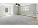 Bedroom with grey carpet, ceiling fan and window at 2610 Henry Baucom Rd, Monroe, NC 28110