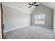 Spacious bedroom featuring a large window and ceiling fan at 2610 Henry Baucom Rd, Monroe, NC 28110