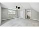 Bedroom with grey carpet, ceiling fan and bathroom access at 2610 Henry Baucom Rd, Monroe, NC 28110