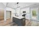 Modern kitchen with white cabinets, quartz countertops, and large island at 2610 Henry Baucom Rd, Monroe, NC 28110