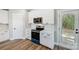 Modern kitchen with white cabinets, blue oven, and subway tile backsplash at 2610 Henry Baucom Rd, Monroe, NC 28110