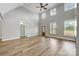 Bright living room with high ceilings, hardwood floors, and large windows at 2610 Henry Baucom Rd, Monroe, NC 28110