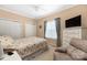 Cozy bedroom with double bed, dresser, and armchair at 7457 Waterleaf Ct, Stanley, NC 28164