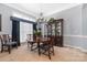 Elegant dining room with hardwood floors and a large window at 7457 Waterleaf Ct, Stanley, NC 28164