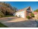 House side view with attached garage at 7457 Waterleaf Ct, Stanley, NC 28164