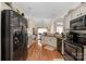 Open kitchen with granite countertops and stainless steel appliances at 7457 Waterleaf Ct, Stanley, NC 28164