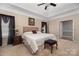 Main bedroom with king-size bed and ensuite bathroom access at 7457 Waterleaf Ct, Stanley, NC 28164