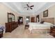 Main bedroom with large bed, dresser, and plenty of natural light at 7457 Waterleaf Ct, Stanley, NC 28164