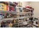 Well-organized pantry with ample shelving for storage at 7457 Waterleaf Ct, Stanley, NC 28164