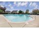 Community swimming pool with lounge chairs at 7457 Waterleaf Ct, Stanley, NC 28164