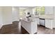 Modern kitchen featuring a large island, stainless steel appliances, granite countertops, and ample cabinet space at 1034 Heath Helms Rd, Monroe, NC 28110