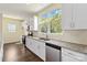 Well-lit kitchen with stainless steel appliances, granite countertops, and white cabinetry for a sleek design at 1034 Heath Helms Rd, Monroe, NC 28110