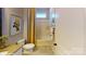 Stylish bathroom with a tub/shower combo and yellow accents at 112 Noah Ln, Troutman, NC 28166