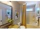 Clean bathroom with tub shower, updated vanity, and a window at 112 Noah Ln, Troutman, NC 28166