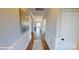 Light and bright hallway with wood flooring and wainscoting at 112 Noah Ln, Troutman, NC 28166
