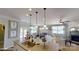 Open concept kitchen with island overlooking living and dining areas at 112 Noah Ln, Troutman, NC 28166