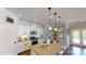 Modern kitchen featuring white cabinets, center island, and stainless steel appliances at 112 Noah Ln, Troutman, NC 28166