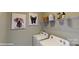 Bright laundry room with washer, dryer, and shelving at 112 Noah Ln, Troutman, NC 28166
