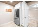 Modern kitchen with stainless steel fridge and white cabinets at 6741 Stillmeadow Dr, Charlotte, NC 28277