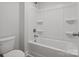 Clean, well-lit bathroom featuring a standard tub and shower combination and a modern toilet at 1051 Bull Dog Ln, Wingate, NC 28174