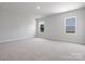 Bright bedroom with neutral carpet and large windows allowing ample natural light at 1051 Bull Dog Ln, Wingate, NC 28174