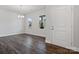 Entryway with hardwood flooring, chandelier, and natural light from windows at 1051 Bull Dog Ln, Wingate, NC 28174