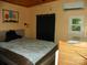 Bright bedroom featuring a bed, wood ceilings, black-out curtains and natural light at 112 S Cardinal Dr, New London, NC 28127