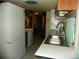 Functional kitchen featuring a stainless steel sink, white appliances, and efficient layout at 112 S Cardinal Dr, New London, NC 28127