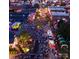 Aerial view of a lively downtown area with people gathered for an evening event at 312 General As Johnston St, Stanley, NC 28164