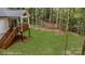 Aerial view of backyard with deck and wooded area at 312 General As Johnston St, Stanley, NC 28164