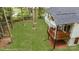 Elevated view of backyard with deck and green lawn at 312 General As Johnston St, Stanley, NC 28164