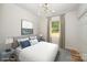 Virtually staged bedroom with window and neutral color scheme at 312 General As Johnston St, Stanley, NC 28164