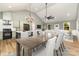 Open concept dining area with a large table and chairs next to the kitchen at 312 General As Johnston St, Stanley, NC 28164