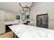 Modern kitchen featuring marble countertops and stainless steel appliances at 312 General As Johnston St, Stanley, NC 28164