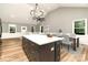 Virtually staged kitchen island with marble countertop and modern cabinetry at 312 General As Johnston St, Stanley, NC 28164