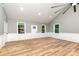 Bright living room with hardwood floors and white wainscoting at 312 General As Johnston St, Stanley, NC 28164