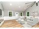 Bright and airy living room with hardwood floors and plenty of natural light at 312 General As Johnston St, Stanley, NC 28164