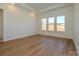 Bright bedroom with hardwood floors and large windows at 1010 Lowland Way, Waxhaw, NC 28173