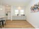 Bright breakfast area with built-in cabinetry and wood flooring at 1010 Lowland Way, Waxhaw, NC 28173