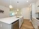 Modern kitchen island with quartz countertop and gold fixtures at 1010 Lowland Way, Waxhaw, NC 28173