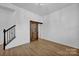 Unfinished basement with barn door and staircase at 129 Eden Ave, Mooresville, NC 28115