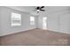 Bright bedroom with neutral carpeting and double windows at 129 Eden Ave, Mooresville, NC 28115