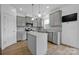 Modern kitchen with stainless steel appliances and gray cabinets at 129 Eden Ave, Mooresville, NC 28115